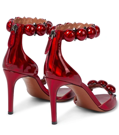 Shop Alaïa La Bombe 90 Patent Leather Sandals In Red