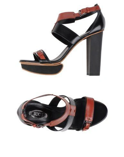 Shop Tod's Sandals In Black