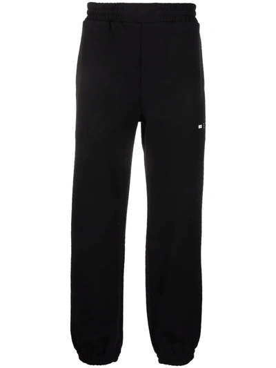 Shop Mcq By Alexander Mcqueen Logo-patch Joggers In Black