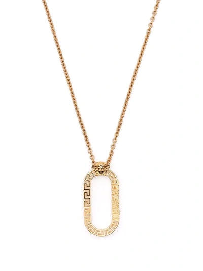 Shop Versace Oval Pendant Necklace In Gold