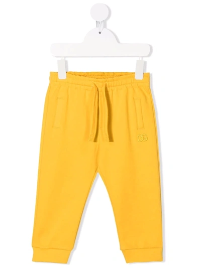 Shop Dolce & Gabbana Embroidered-logo Track Trousers In Yellow