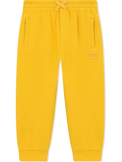 Shop Dolce & Gabbana Embroidered Logo Track Trousers In Yellow