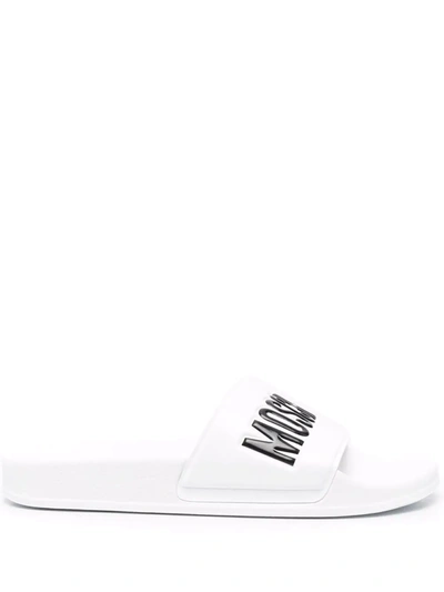 Shop Moschino Logo Slip On Sliders In White