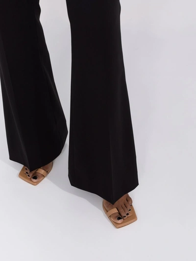 Shop Jacquemus Pinu Trousers In Black