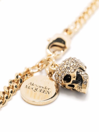 Shop Alexander Mcqueen Skulls Bracelet In Gold