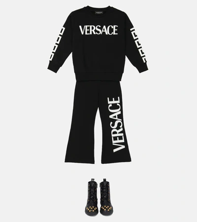Shop Versace Logo Cotton-blend Flared Pants In Nero+bianco