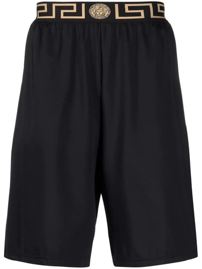 Shop Versace Greca Border Swim Shorts In Schwarz