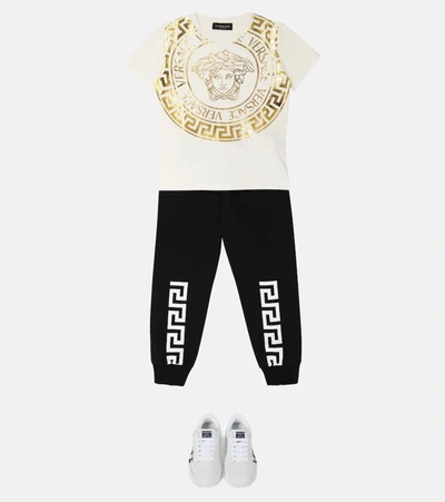 Shop Versace Greca Cotton Sweatpants In Nero + Bianco