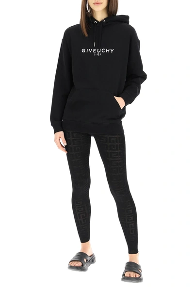 Shop Givenchy Reverse Logo Hoodie In Black