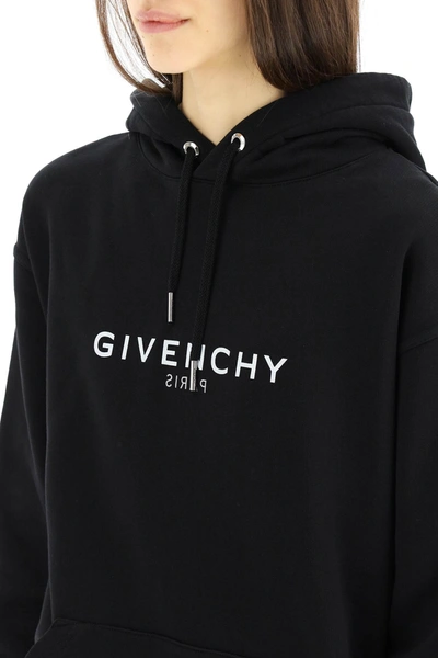 Shop Givenchy Reverse Logo Hoodie In Black