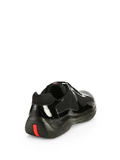 Shop Prada Patent Leather Sneakers In Black