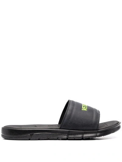 Shop Vetements Logo Embossed Slides In Black