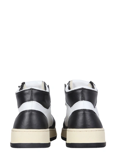 Shop Autry Medalist Mid Cut Sneakers In Black