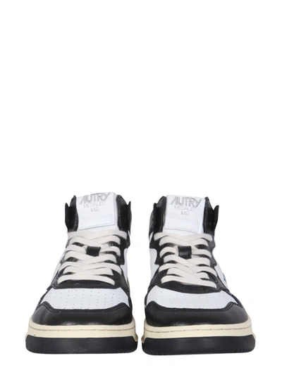 Shop Autry Medalist Mid Cut Sneakers In Black