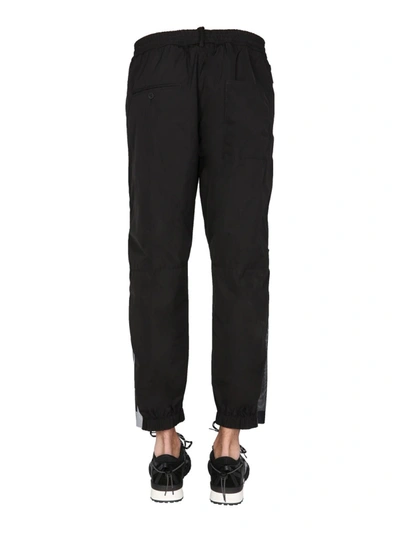 Shop Dsquared2 Trousers With Logo Print In Black