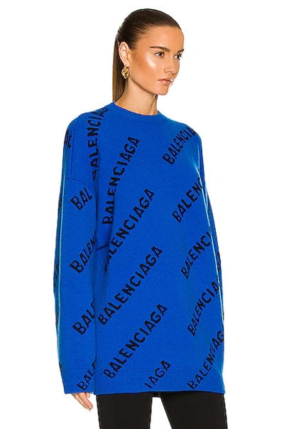 Shop Balenciaga All Over Logo Crewneck Sweater In Blue & Black