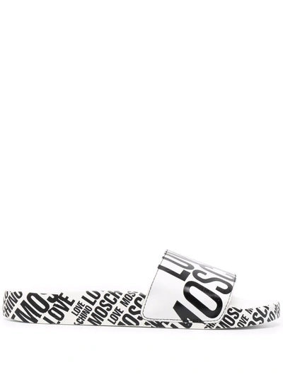 Shop Love Moschino Logo Print Slides In White