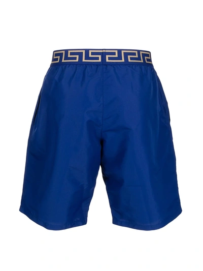 Shop Versace Logo Embroidered Swim Shorts In Blue