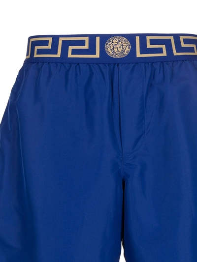 Shop Versace Logo Embroidered Swim Shorts In Blue
