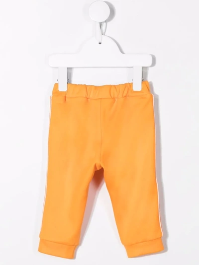 Shop Fendi Ff-stripe Track Pants In Orange