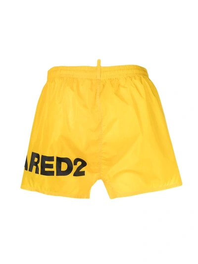 Shop Dsquared2 Logo-print Drawstring Swim Shorts In Yellow