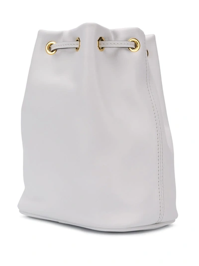 Shop Moschino Logo Bucket Bag In White
