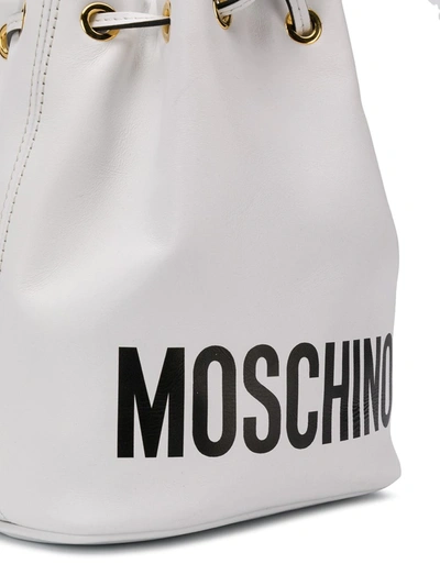 Shop Moschino Logo Bucket Bag In White
