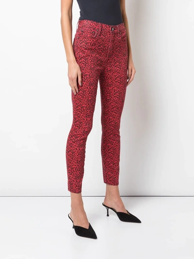 Shop Alice And Olivia Leopard Skinny Trousers In Red