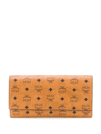 Shop Mcm Large Tri-fold Wallet In Brown