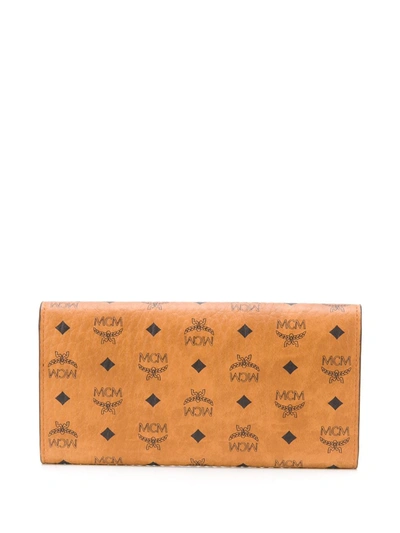 Shop Mcm Large Tri-fold Wallet In Brown