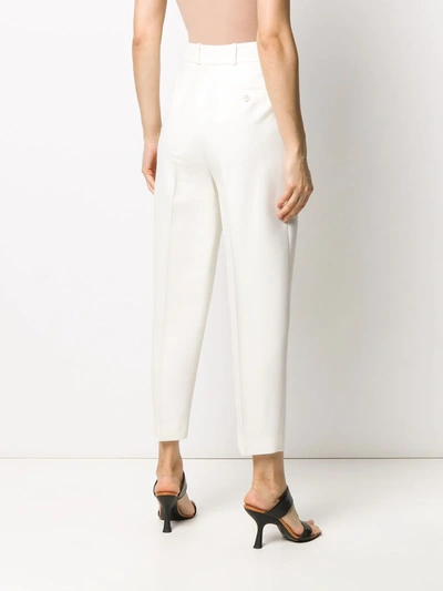 Shop Alexander Mcqueen Pleated Tapered Trousers In Neutrals