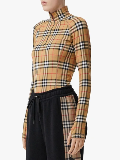 Shop Burberry Check Turtleneck Zip Top In Multicolour