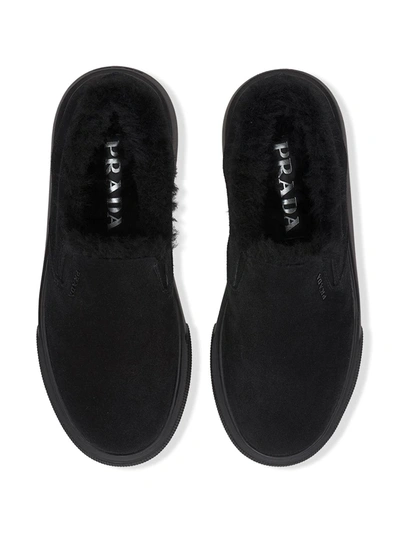 Shop Prada Shearling Low-top Sneakers In Black