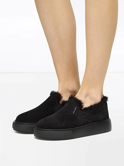 Shop Prada Shearling Low-top Sneakers In Black