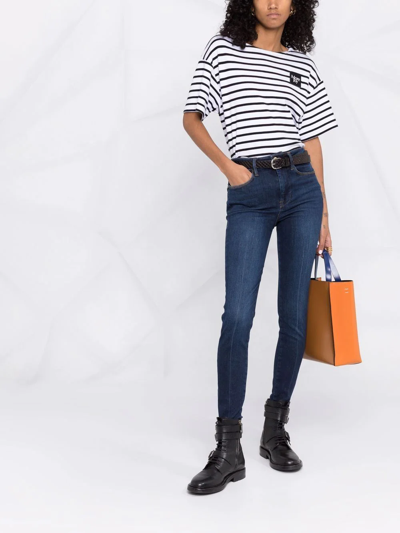 Shop Frame High-rise Skinny Jeans In Blau