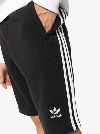 Shop Adidas Originals Three-stripe Track Trousers In Black