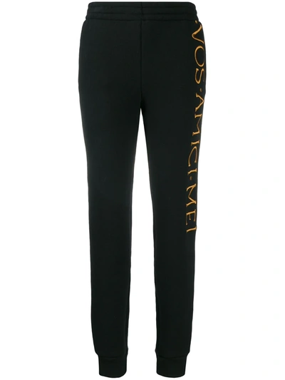 Shop Moschino Embroidered Logo Track Trousers In Black