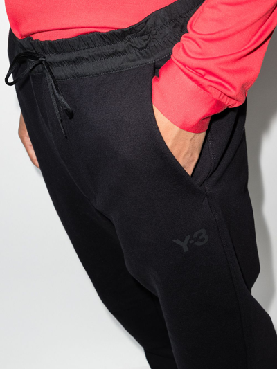 Shop Y-3 Logo-print Tapered Track Pants In Black