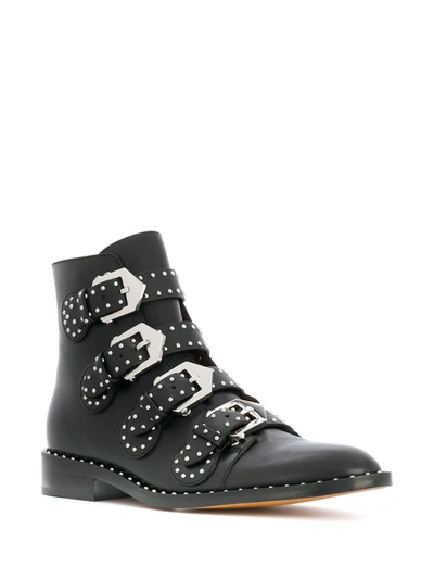 Shop Givenchy Studded Buckled Boots In Black