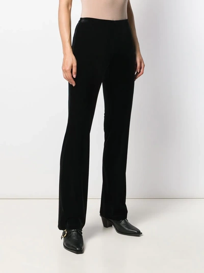 Shop Blanca Velvet Flared Trousers In Black