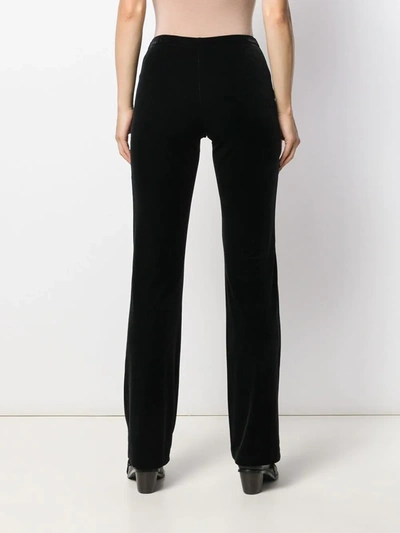 Shop Blanca Velvet Flared Trousers In Black