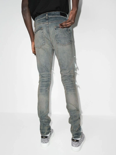 Shop Amiri Pj Trasher Distressed-effect Skinny Jeans In Blue