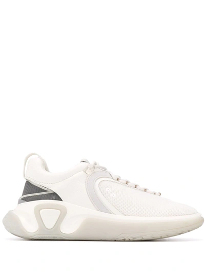 Shop Balmain B-runner Asymmetrical Sneakers In White