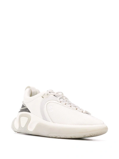 Shop Balmain B-runner Asymmetrical Sneakers In White