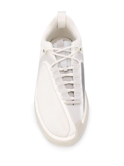 Shop Balmain B-runner Asymmetrical Sneakers In White