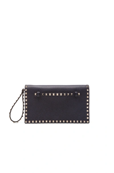 Valentino Garavani Rockstud Flap Clutch In Deep Denim