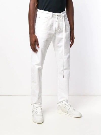 Shop Off-white Loose Fitted Jeans In White