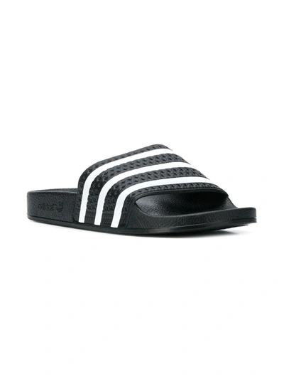 Shop Adidas Originals Adilette Striped Slides In Black