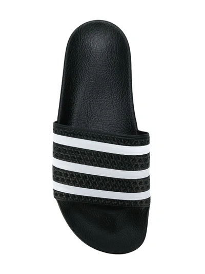 Shop Adidas Originals Adilette Striped Slides In Black