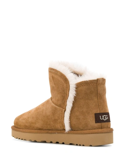 Shop Ugg Mini Fluff Slip-on Boots In Brown
